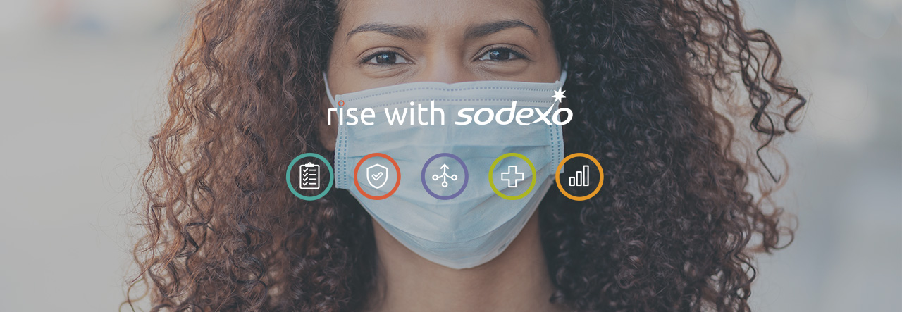 Woman wearing a mask and rise with Sodexo logo