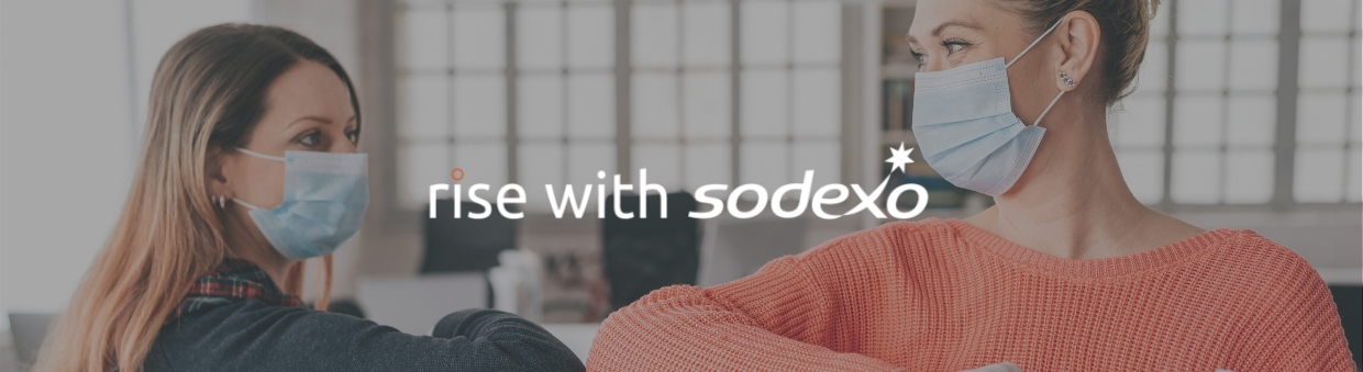 Woman wearing a mask and rise with Sodexo logo