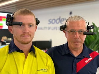Two Sodexo employees are waring AR glasses